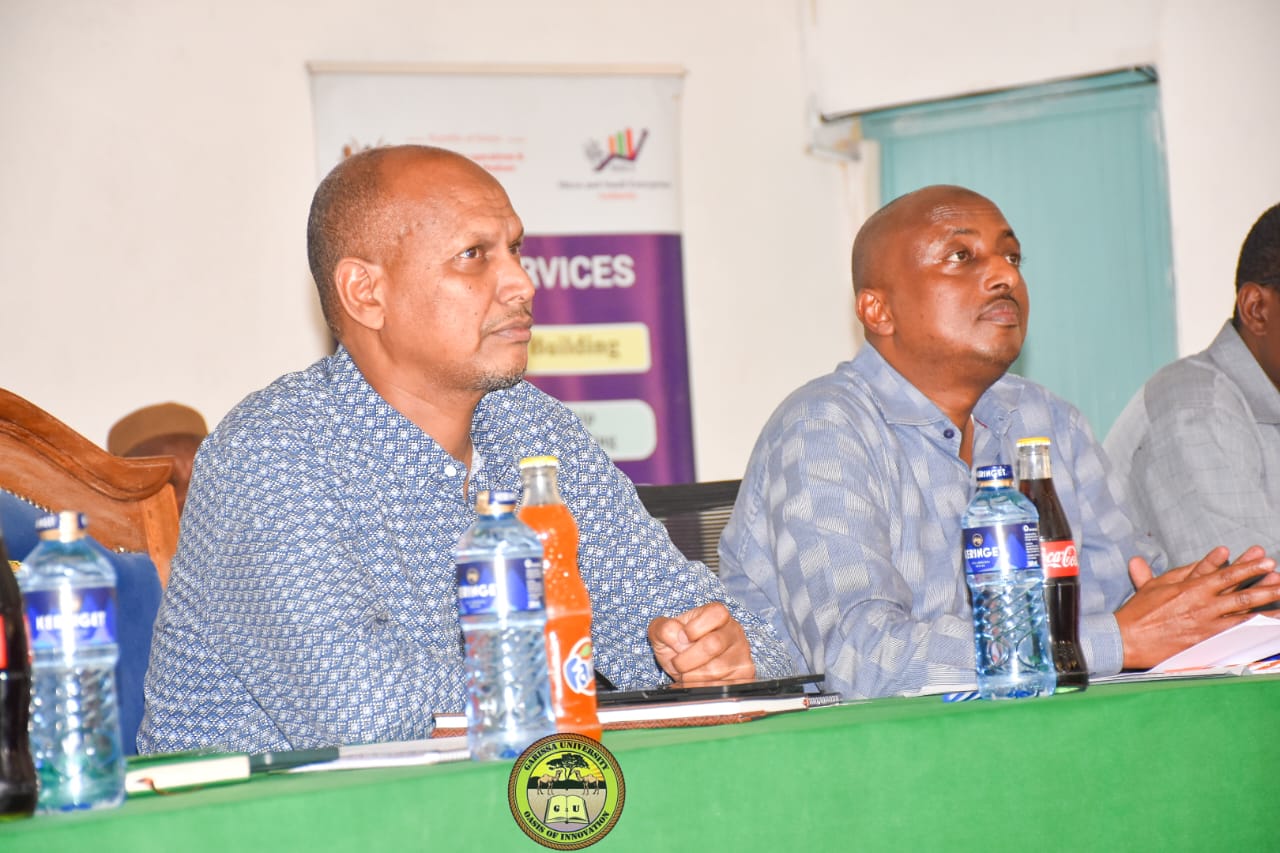 Principal Secretary State Department for Shipping and Maritime Affairs Aden Millah on left, during NYOTA Project sensitization forum at Garissa University.