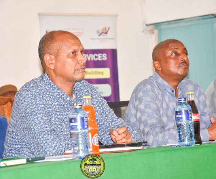 Principal Secretary State Department for Shipping and Maritime Affairs Aden Millah on left, during NYOTA Project sensitization forum at Garissa University.