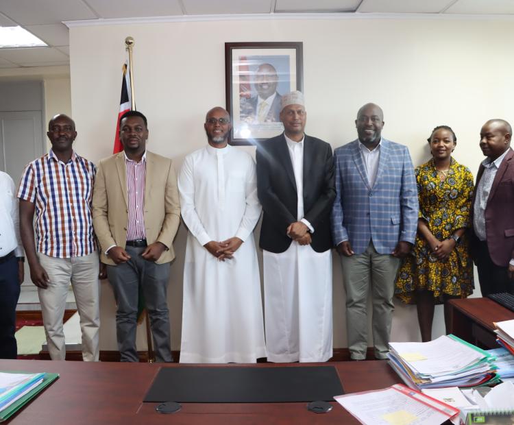 PS Aden Millah posing for a photo with a delegation from TradeMark Africa 