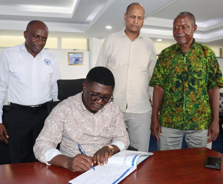 State Department for Shipping and Maritime Affairs, Mr. Aden A. Millah joins his counterpart Principal Secretary, State Department for Youth Affairs and Creative Economy, Mr. Fikirini Jacobs at Bandari Maritime Academy (BMA) while a visitor's book